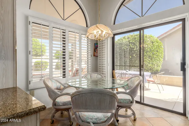 a view of a dining room with furniture window and outside view