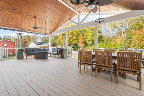 a view of a chairs and table in the patio