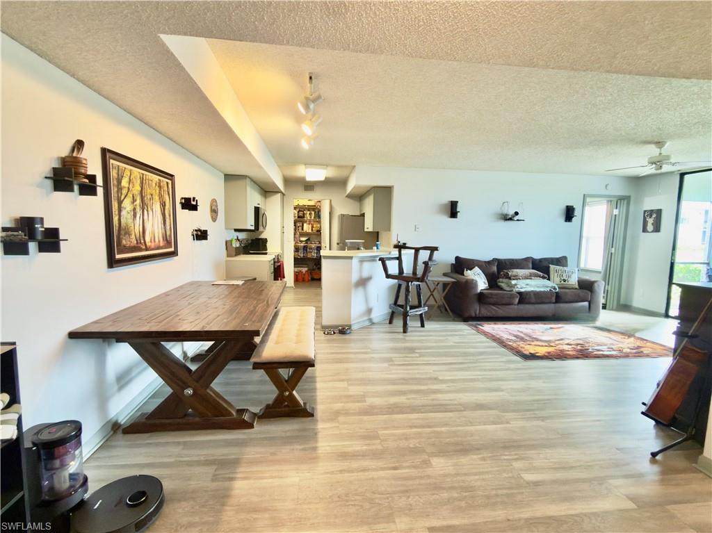 13615 Eagle Ridge Drive, Unit 1614 Fort Myers, FL 33912 - Photo 25 of 34 Fitness center featuring rubberized flooring, multiple windows, and recessed lighting