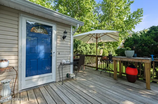 a view of a balcony with furniture and umbrella