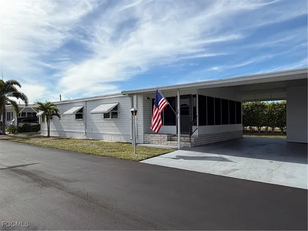 a view of parking space and garage