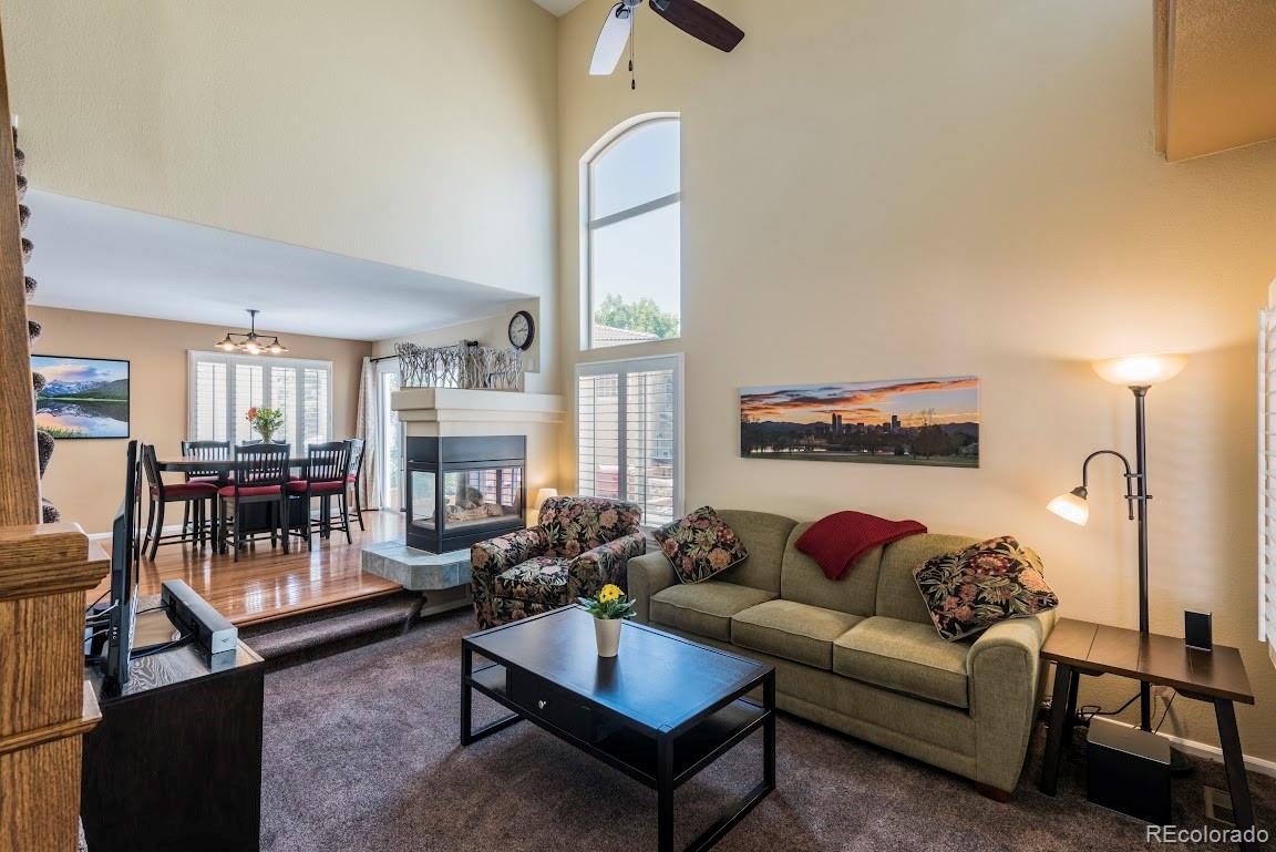 1279 Braewood Avenue Highlands Ranch, CO 80129 - Photo 13 of 20 a living room with furniture and a fireplace