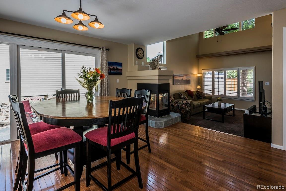 1279 Braewood Avenue Highlands Ranch, CO 80129 - Photo 17 of 20 a view of a dining room with furniture and wooden floor