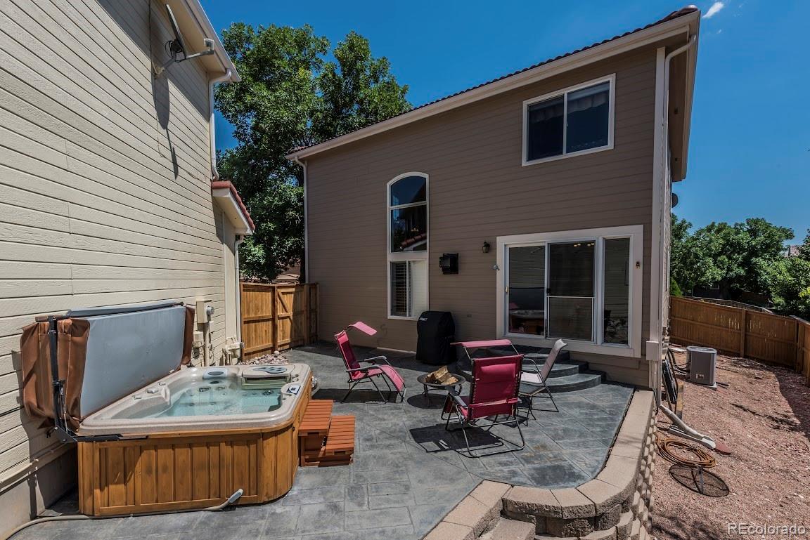 1279 Braewood Avenue Highlands Ranch, CO 80129 - Photo 20 of 20 a backyard of a house with outdoor seating