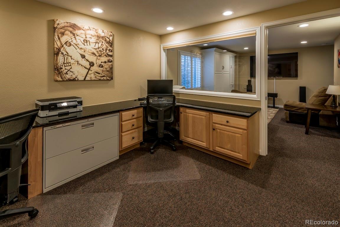 1279 Braewood Avenue Highlands Ranch, CO 80129 - Photo 2 of 20 a kitchen with stainless steel appliances granite countertop a stove and a sink