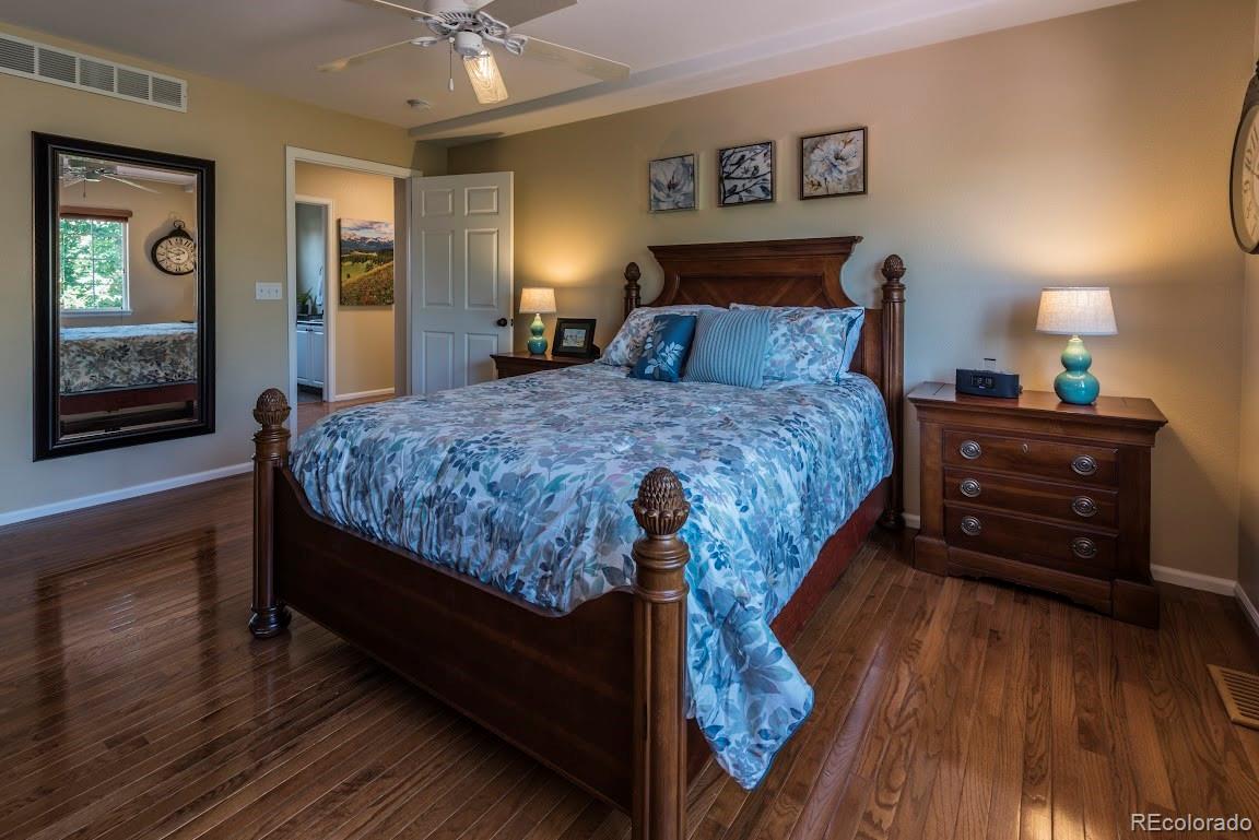 1279 Braewood Avenue Highlands Ranch, CO 80129 - Photo 10 of 20 a bedroom with a bed and window