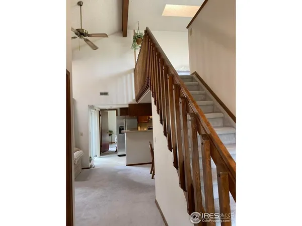 a view of a hallway with staircase