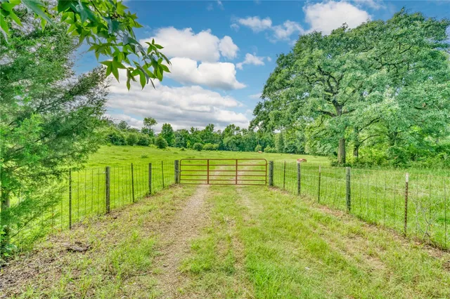a view of a golf course with a lake view