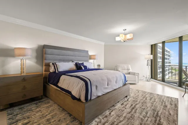 a bedroom with a bed and a lamp with table