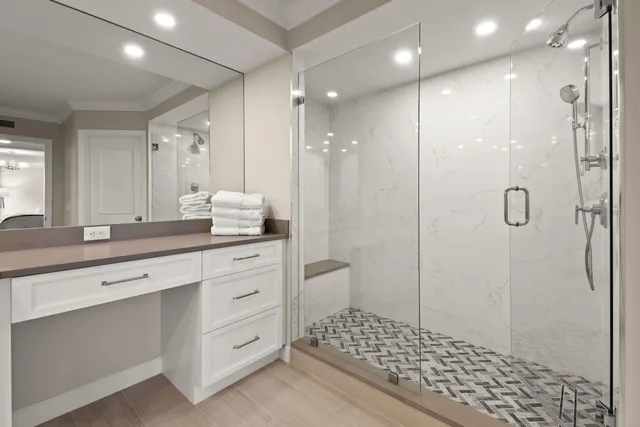 a bathroom with a shower sink and mirror