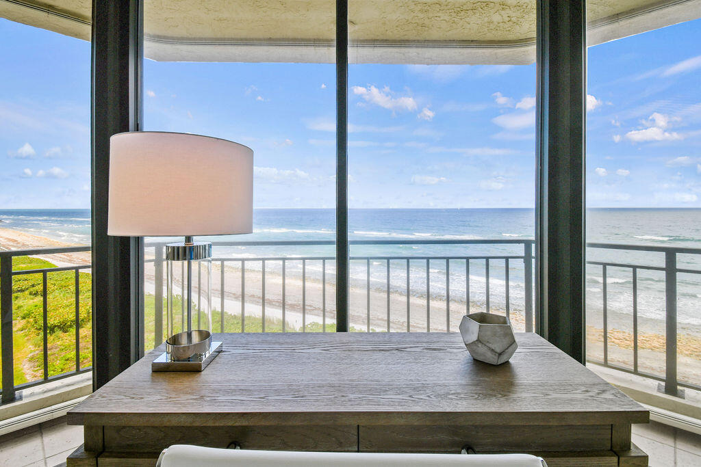 19850 South Beach Road, Unit 5A Jupiter, FL 33469 - Photo 5 of 28 a living room with a window