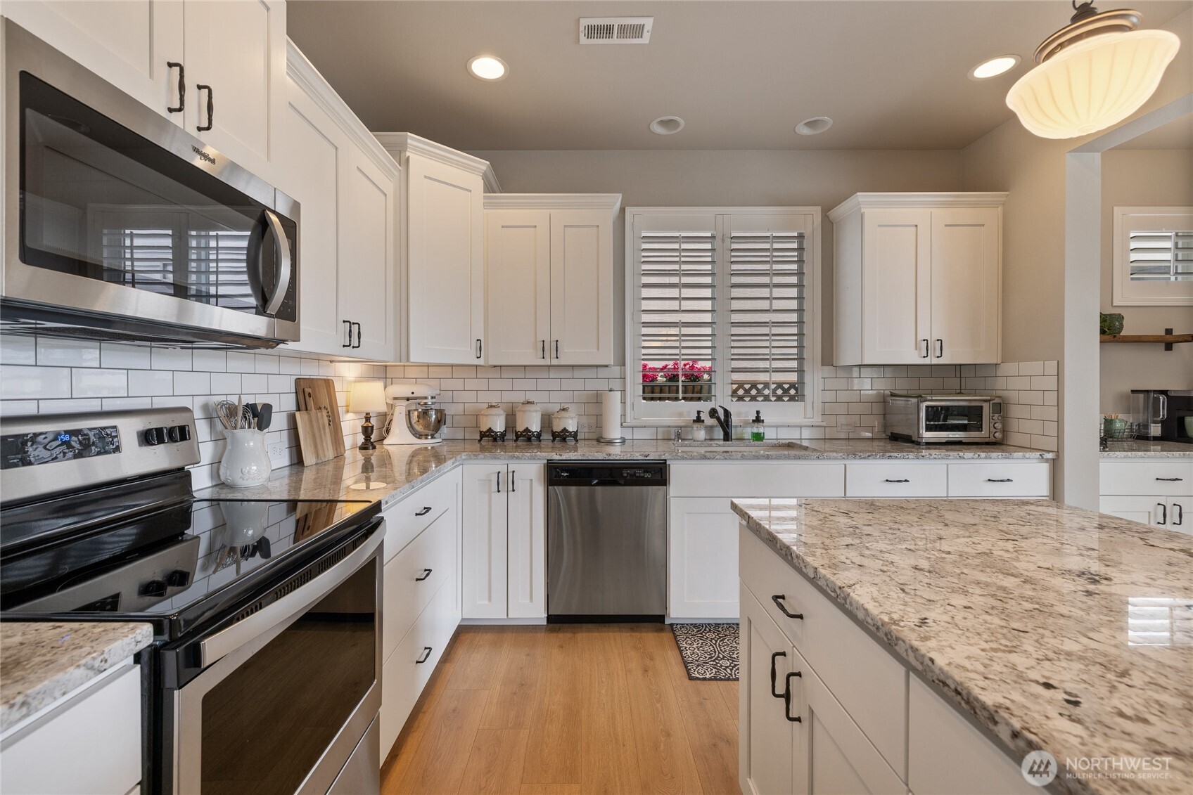 5641 Parquet Way Southeast Lacey, WA 98513 - Photo 15 of 39 a kitchen with a stove microwave and sink