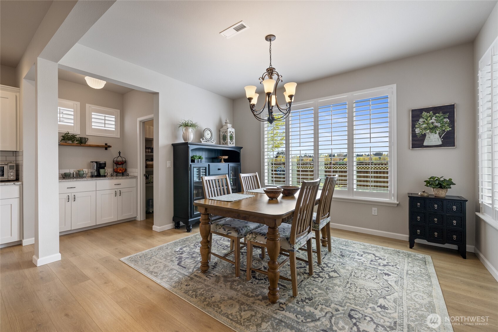 5641 Parquet Way Southeast Lacey, WA 98513 - Photo 20 of 39 a view of a dining room with furniture window and wooden floor