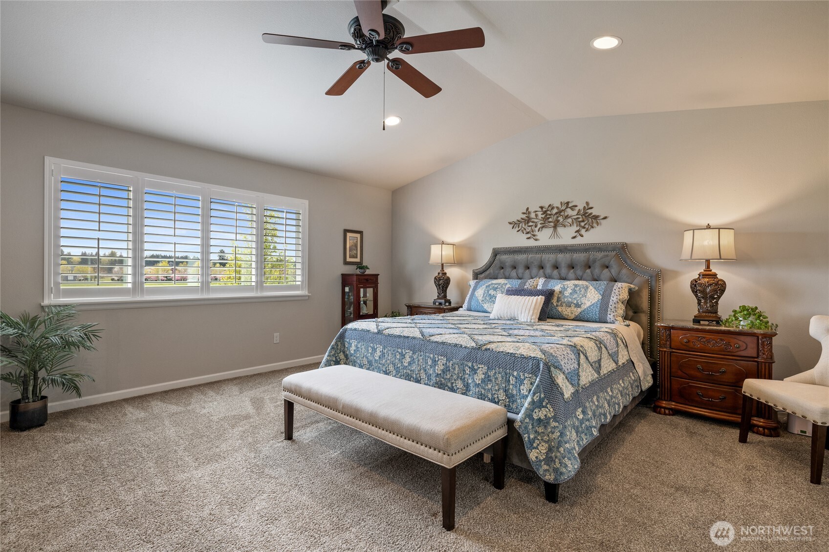 5641 Parquet Way Southeast Lacey, WA 98513 - Photo 23 of 39 a bedroom with a bed and a chandelier
