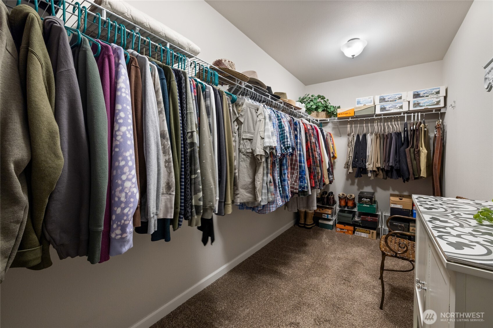 5641 Parquet Way Southeast Lacey, WA 98513 - Photo 24 of 39 a view of walk in closet with clothes and shoes