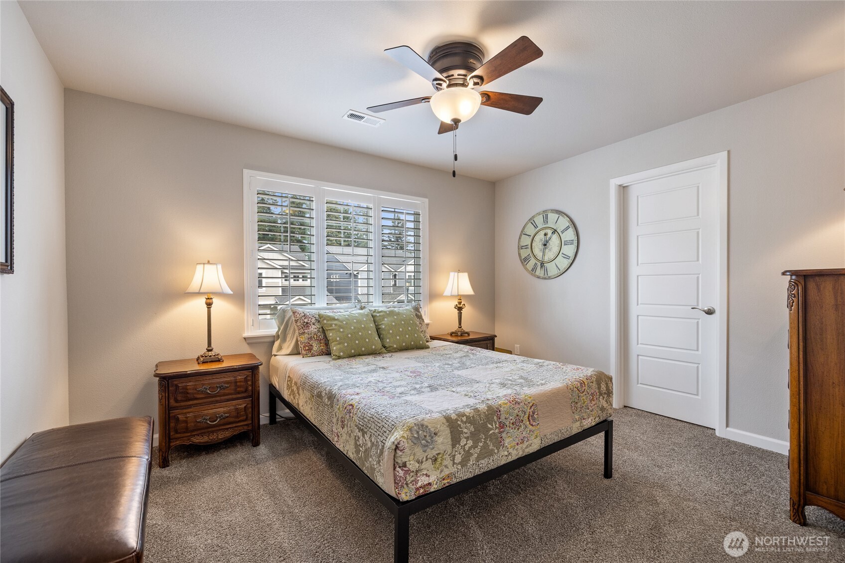 5641 Parquet Way Southeast Lacey, WA 98513 - Photo 29 of 39 a bedroom with a bed a window and a chandelier