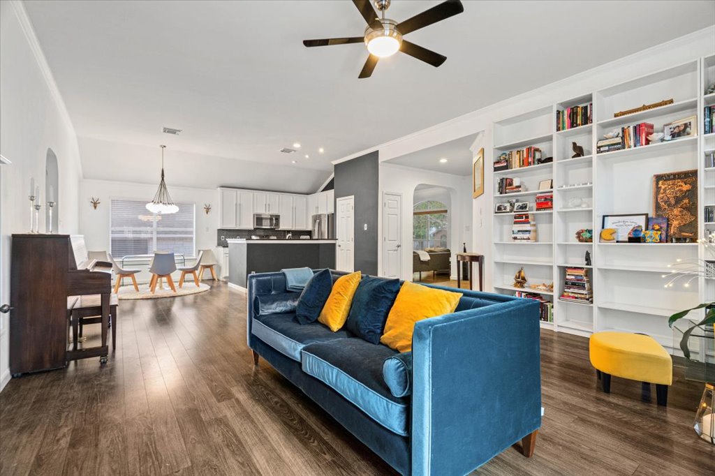 5948 Lomita Verde Circle Austin, TX 78749 - Photo 12 of 31 a living room with furniture and a kitchen view with wooden floor