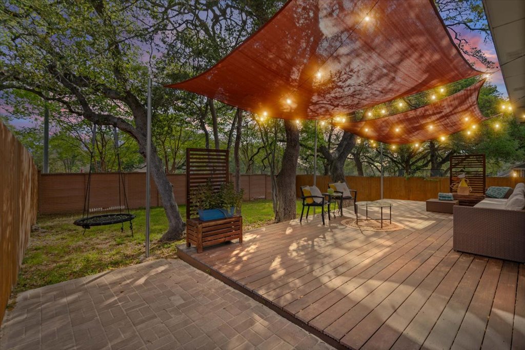 5948 Lomita Verde Circle Austin, TX 78749 - Photo 14 of 31 a view of a backyard with sitting area