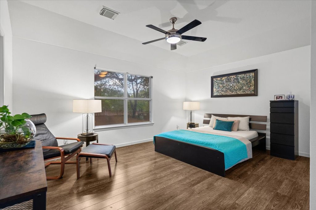 5948 Lomita Verde Circle Austin, TX 78749 - Photo 20 of 31 a bedroom with a bed window and a chair