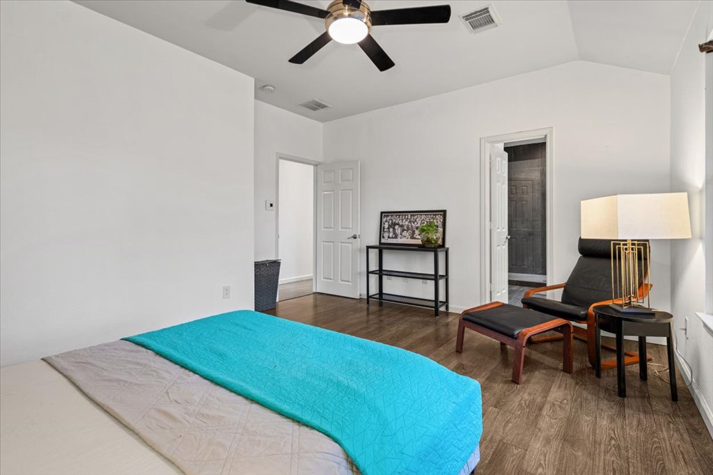 5948 Lomita Verde Circle Austin, TX 78749 - Photo 21 of 31 a bedroom with a bed furniture and wooden floor