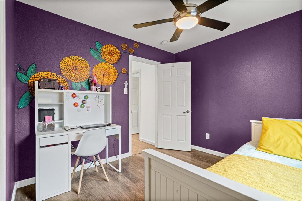 5948 Lomita Verde Circle Austin, TX 78749 - Photo 25 of 31 a bedroom with a bed and a table in it