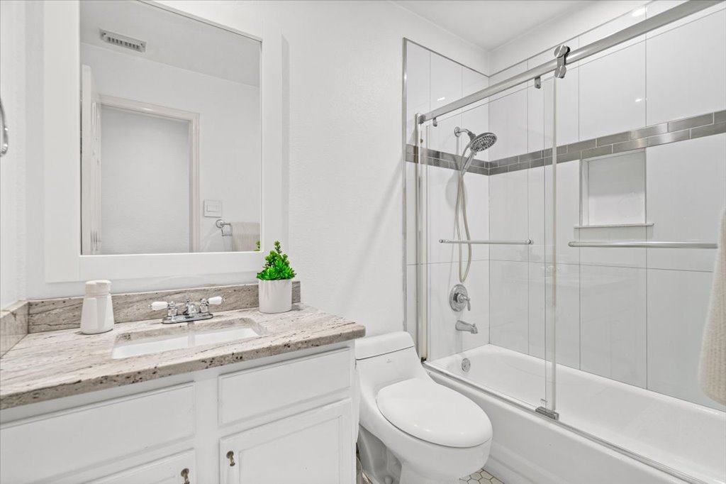 5948 Lomita Verde Circle Austin, TX 78749 - Photo 26 of 31 a bathroom with a granite countertop sink toilet and shower