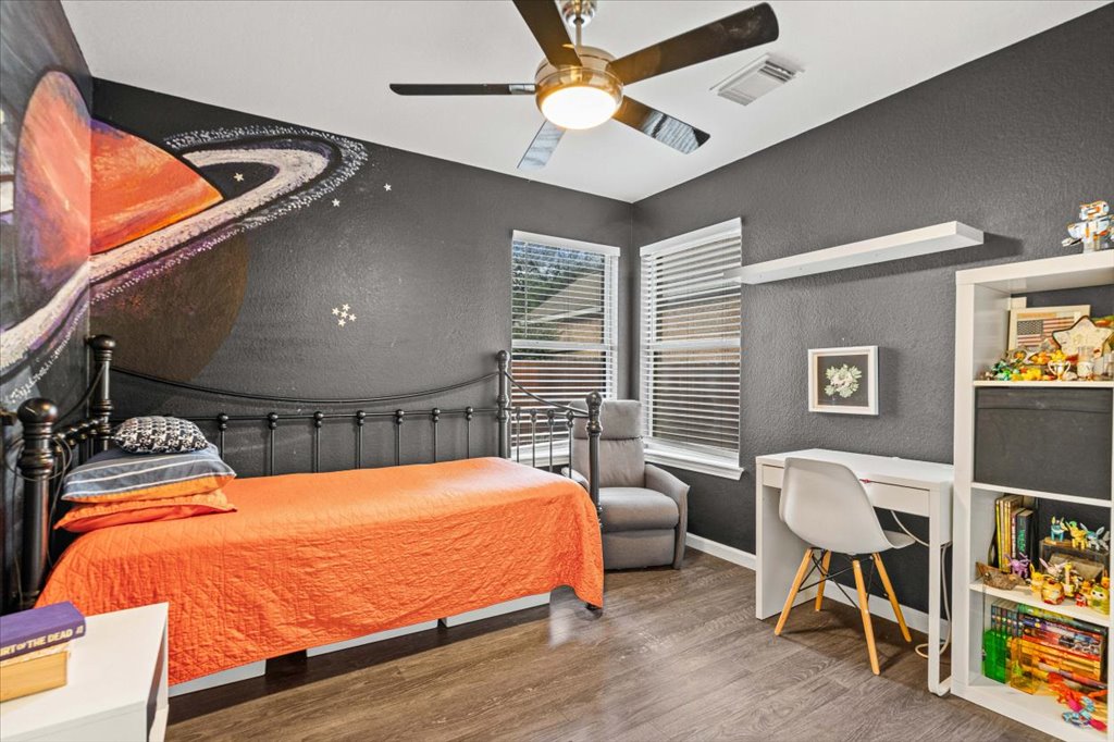 5948 Lomita Verde Circle Austin, TX 78749 - Photo 27 of 31 a bedroom with a bed and ceiling fan