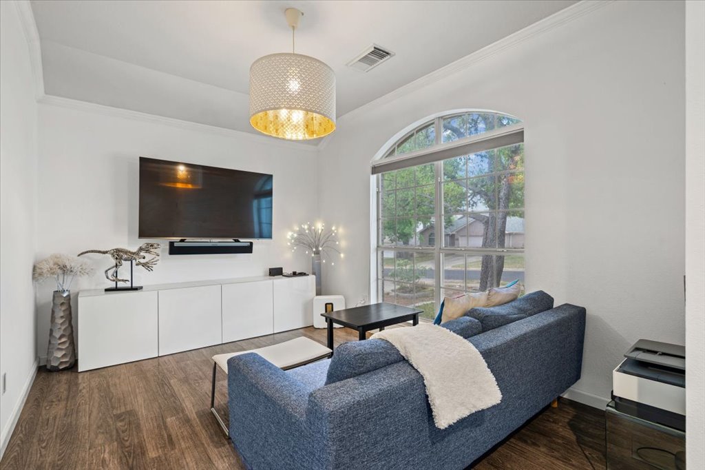 5948 Lomita Verde Circle Austin, TX 78749 - Photo 4 of 31 a living room with furniture and a flat screen tv