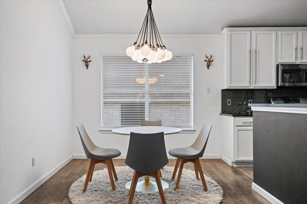 5948 Lomita Verde Circle Austin, TX 78749 - Photo 8 of 31 a view of a dining room with furniture and wooden floor