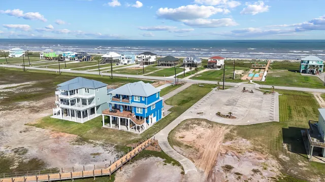 an aerial view of a house with a ocean view