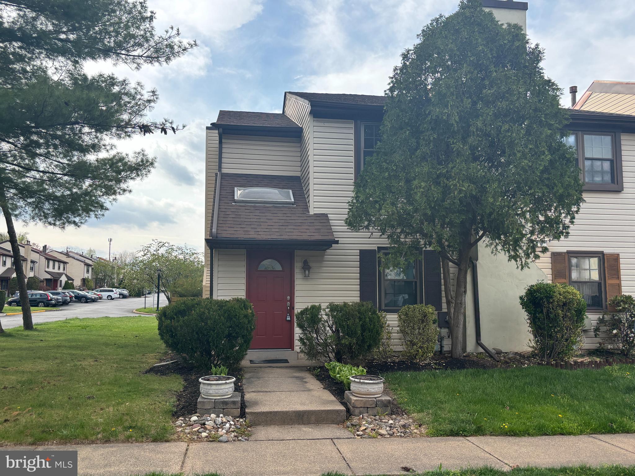 a view of backyard of house with outdoor seating