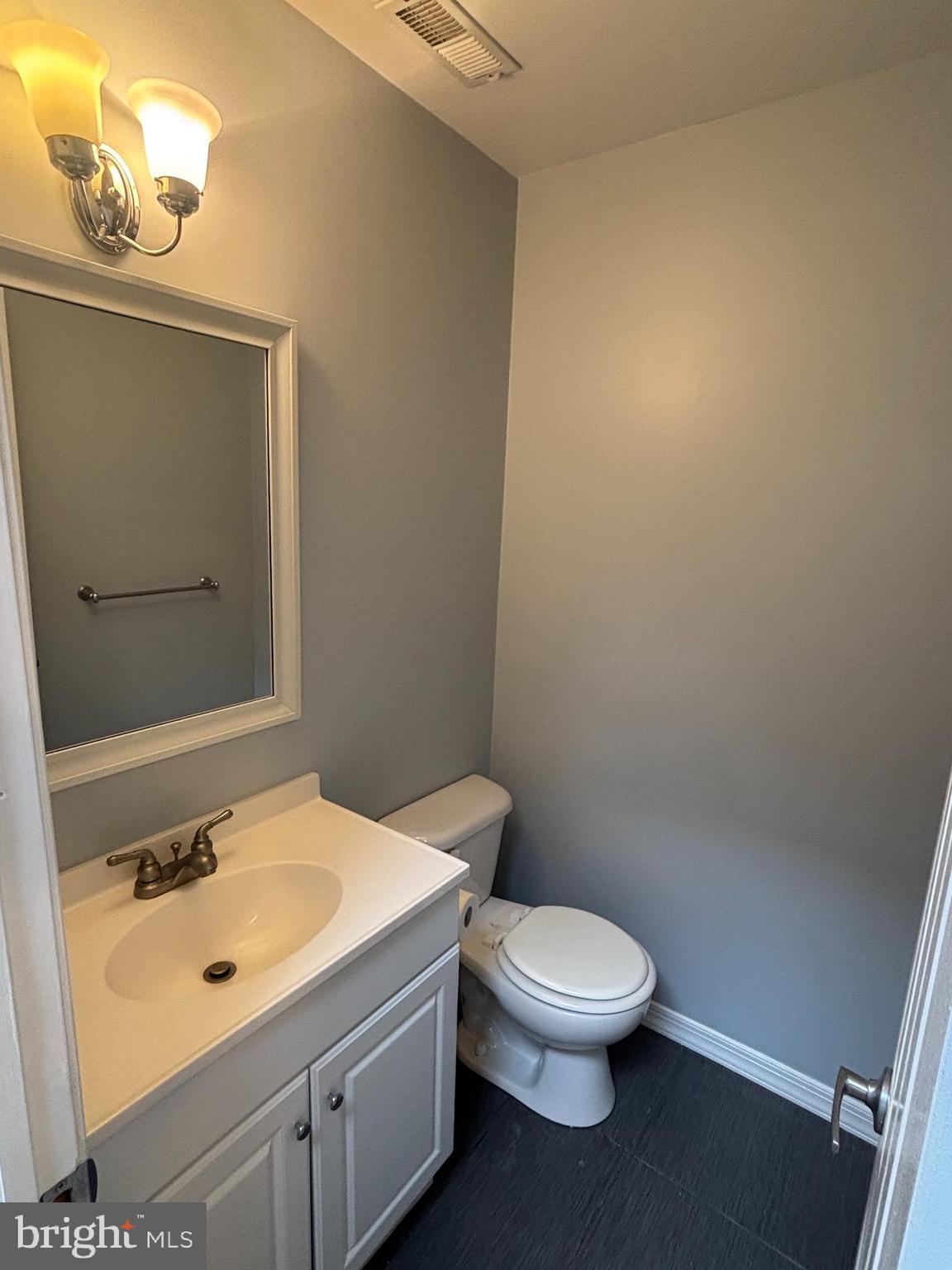 1460 Tarleton Place Warminster, PA 18974 - Photo 2 of 12 a bathroom with a toilet a sink and mirror