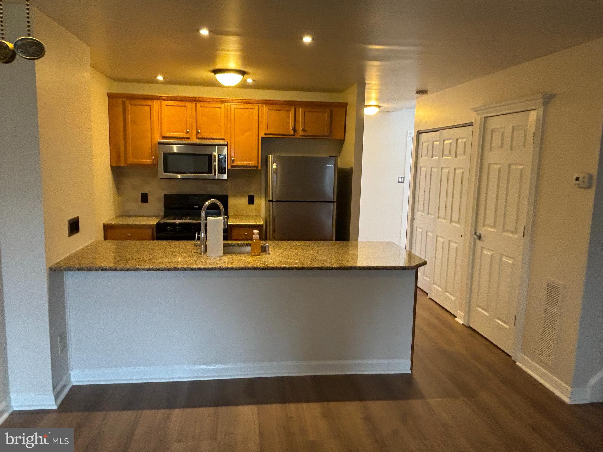 1460 Tarleton Place Warminster, PA 18974 - Photo 6 of 12 a view of kitchen with stainless steel appliances wooden floor and large window