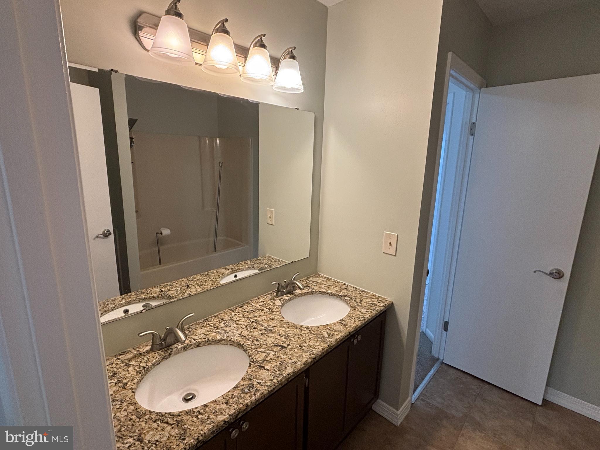 1460 Tarleton Place Warminster, PA 18974 - Photo 8 of 12 a bathroom with a granite countertop sink and a mirror