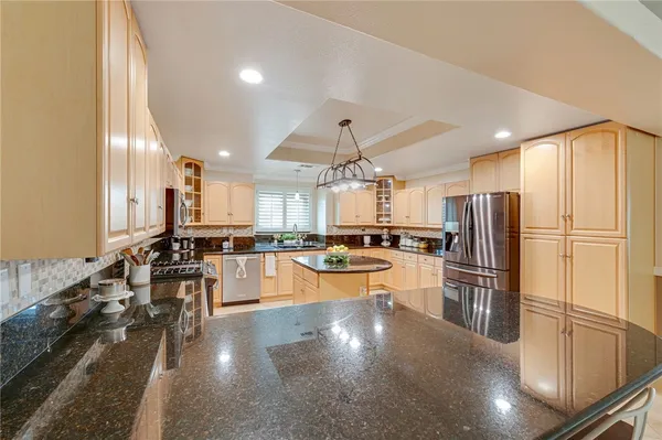a kitchen with a refrigerator and a sink