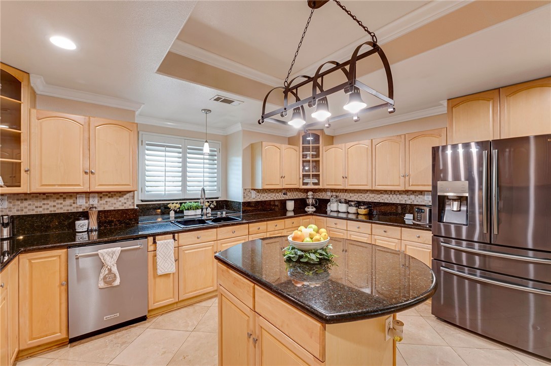 14396 Nautical Lane Helendale, CA 92342 - Photo 13 of 43 a kitchen with granite countertop a sink stainless steel appliances and window