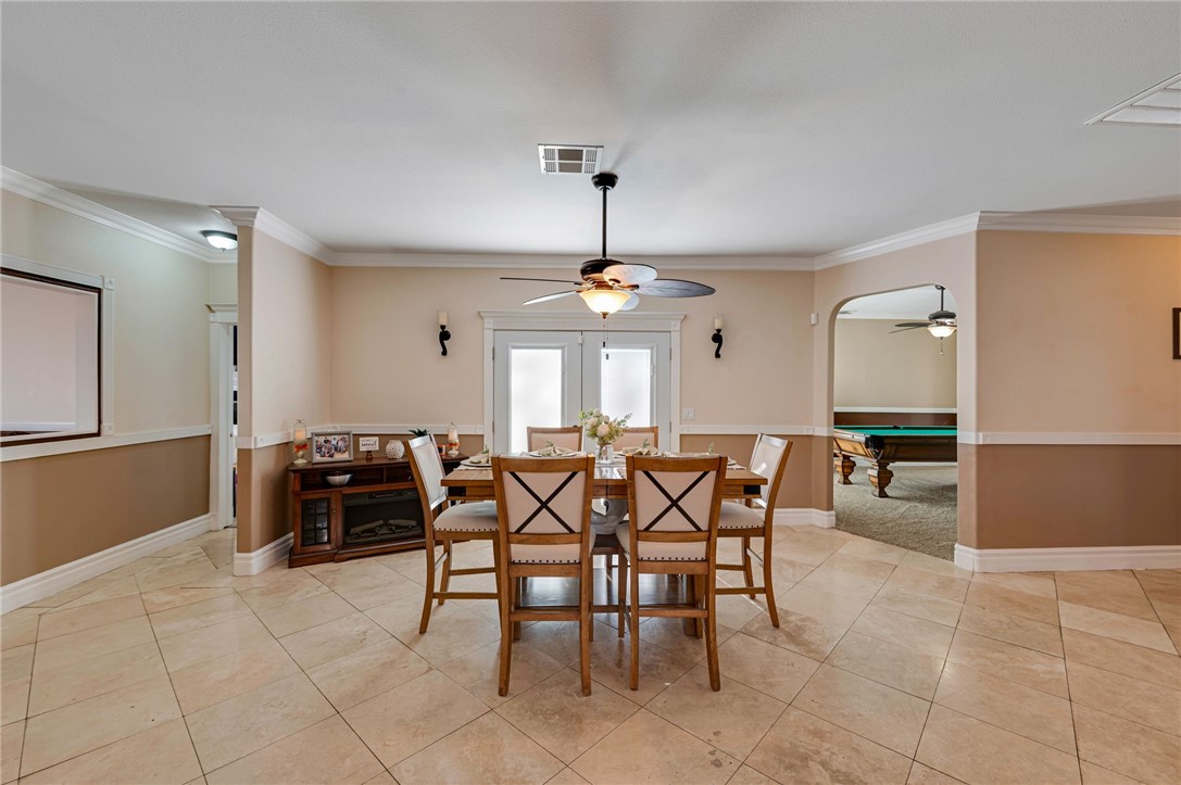 14396 Nautical Lane Helendale, CA 92342 - Photo 15 of 43 a dining room with furniture and a chandelier