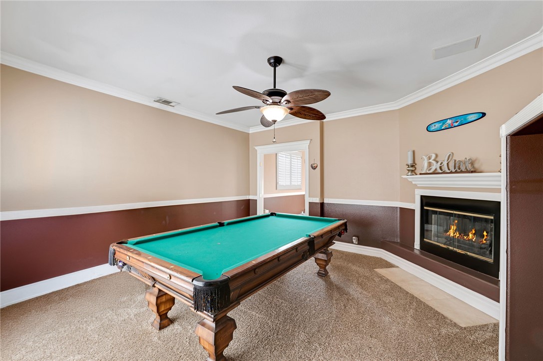 14396 Nautical Lane Helendale, CA 92342 - Photo 16 of 43 a room with pool table and a fireplace