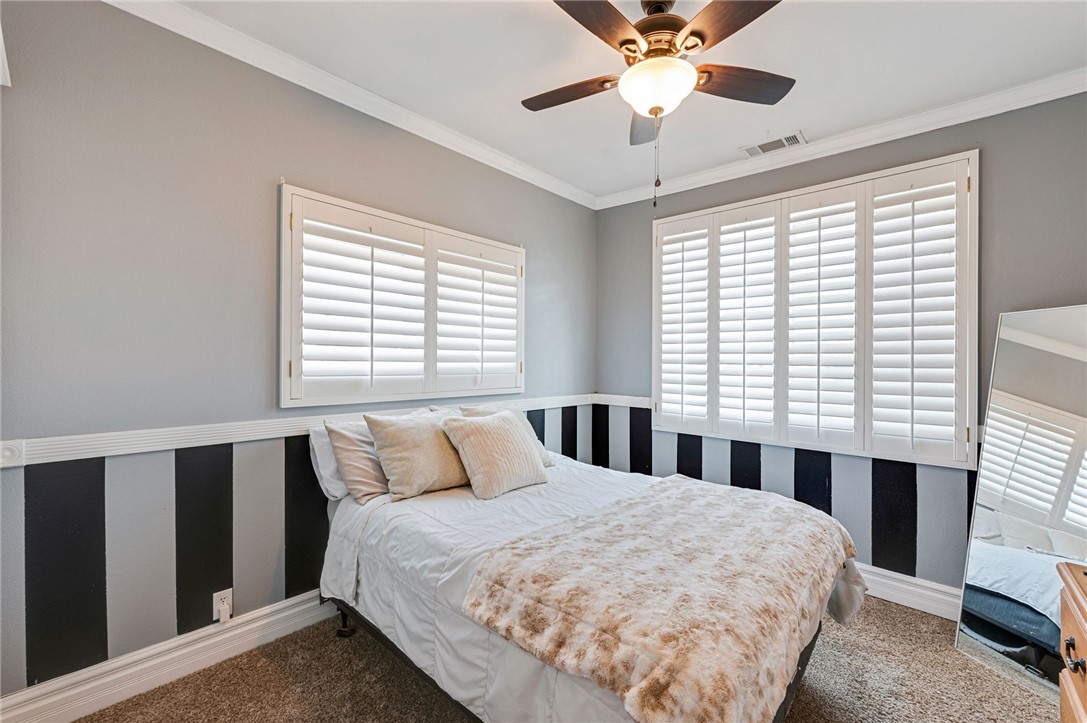 14396 Nautical Lane Helendale, CA 92342 - Photo 19 of 43 a bedroom with a bed and a large window