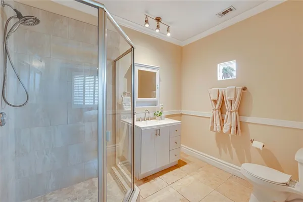 a bathroom with a bathtub sink and mirror