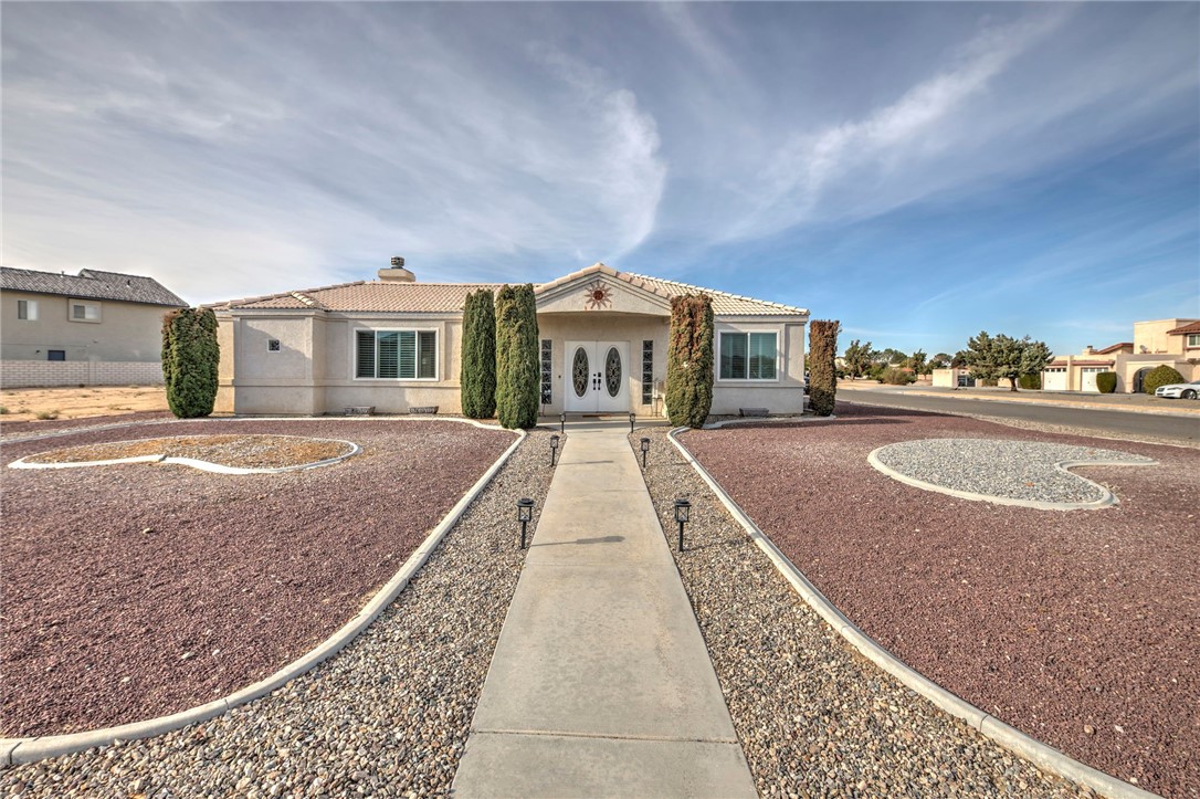 14396 Nautical Lane Helendale, CA 92342 - Photo 2 of 43 a front view of a house with a yard