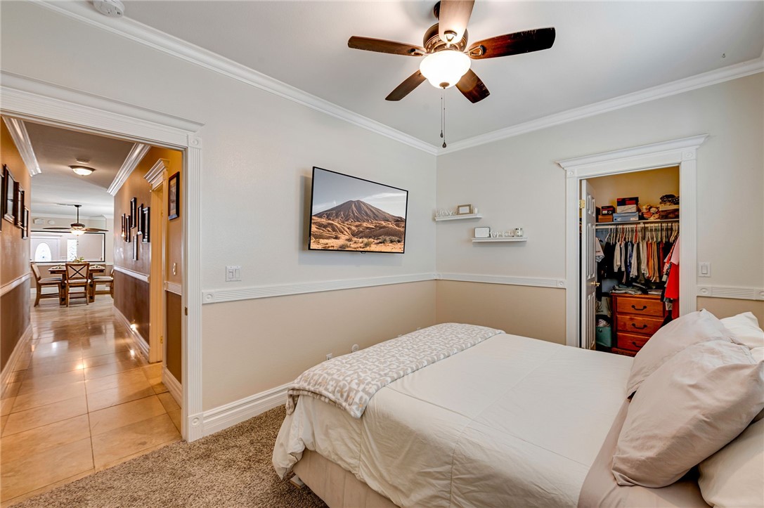 14396 Nautical Lane Helendale, CA 92342 - Photo 28 of 43 a bedroom with a bed and a painting on the wall