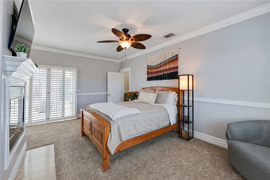 14396 Nautical Lane Helendale, CA 92342 - Photo 30 of 43 a bed room with a bed and a chandelier