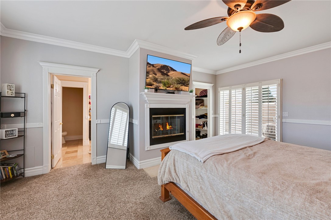 14396 Nautical Lane Helendale, CA 92342 - Photo 31 of 43 a bedroom with a bed and a fireplace