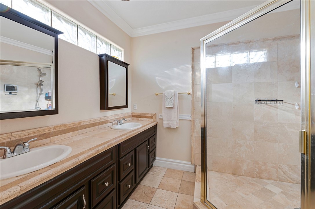 14396 Nautical Lane Helendale, CA 92342 - Photo 34 of 43 a bathroom with a double vanity sink mirror and shower