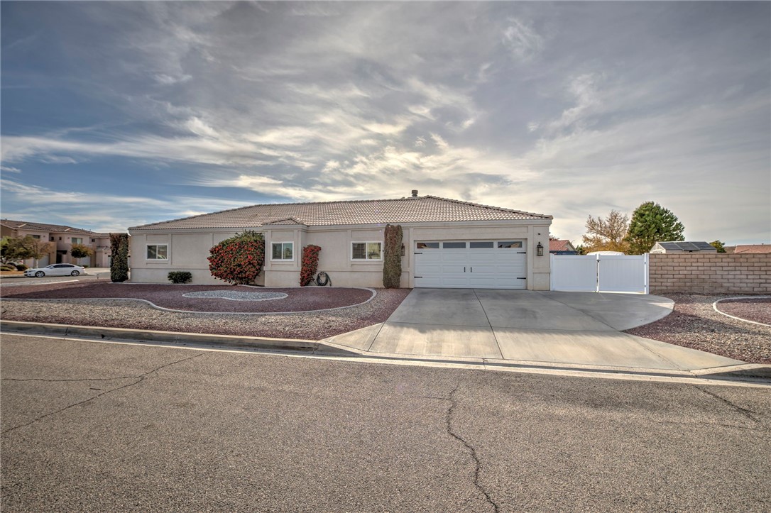 14396 Nautical Lane Helendale, CA 92342 - Photo 4 of 43 a view of a house with a yard and a car parked