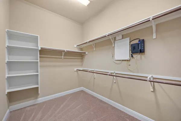 a bathroom with a tub a mirror and a shower