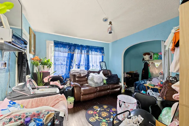 a bed room with furniture and a window