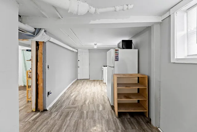 a view of hallway with wooden floor