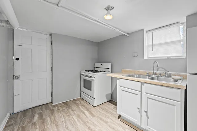 a room with a sink and a window